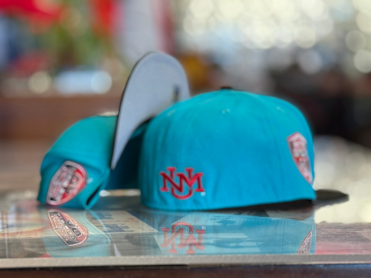 UNM Lobos New Era 5950 Turquoise Black Bill and Lobo Louie front
