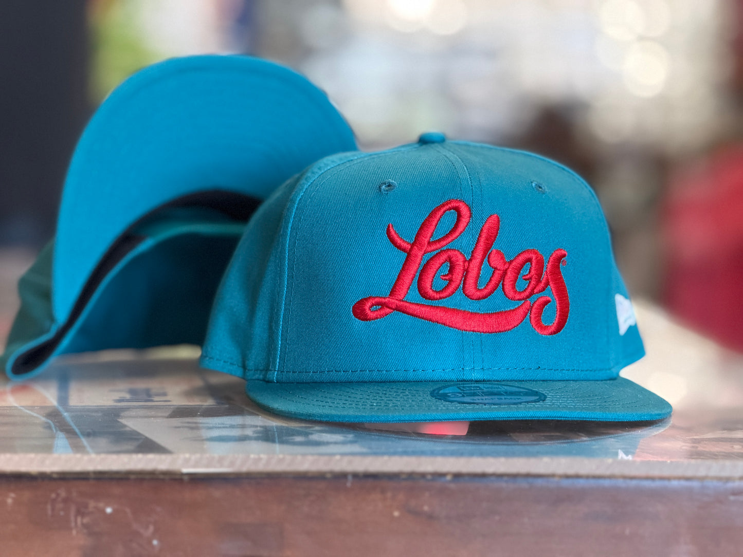 UNM Lobos New Era 950 Snapback Turquoise Lobos Script