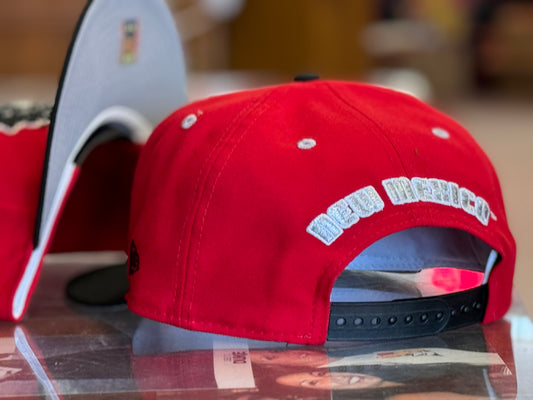 UNM 950 Snapback Red with 1970's Lobo logo and Black bill