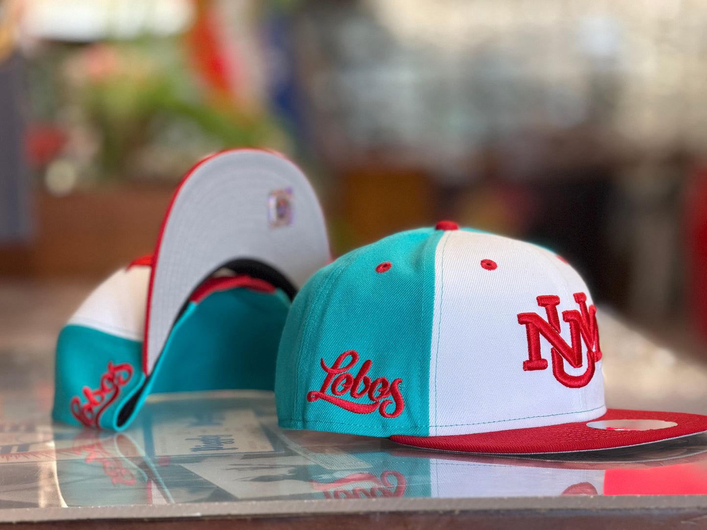 UNM New Era 950 Snapback Turquoise White UNM logo and Red bill